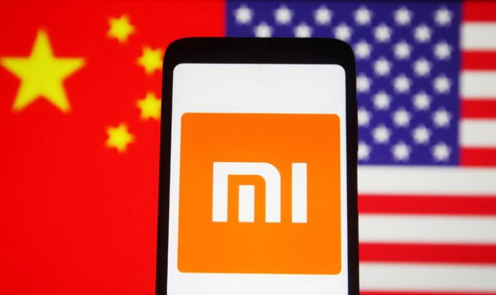 In this photo illustration, Xiaomi logo is seen on a Xiaomi