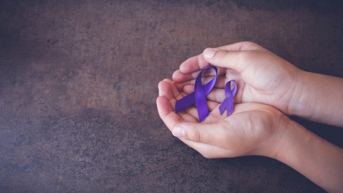 hands holding Purple ribbons,toning copy space background, Alzheimer's disease, Pancreatic cancer, Epilepsy awareness, Hodgkin's Lymphoma awareness, panoramic banner