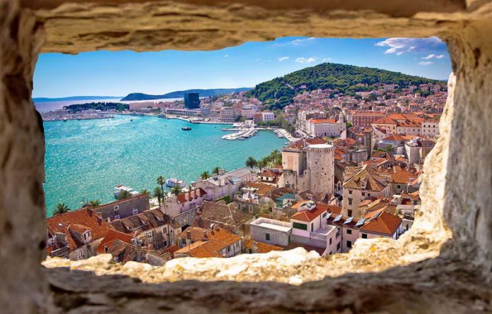 Split bay aerial view through stone window