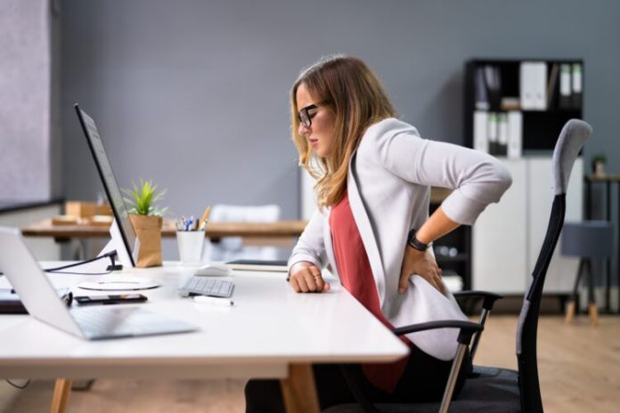 Back,Pain,Bad,Posture,Woman,Sitting,In,Office